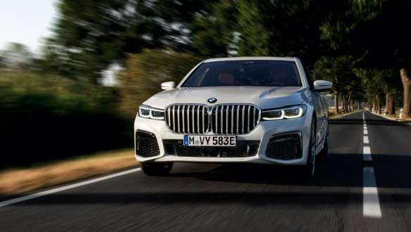 BMW 7 Series Sedan plug-in hybrid G11 G12 front view driving BMW 7 Series Sedan plug-in hybrid G11 G12 front view driving on the street