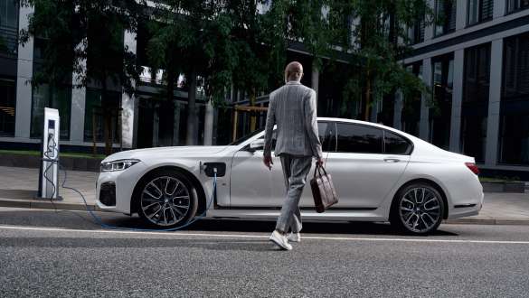 BMW 7 Series Sedan plug-in hybrid G11 G12 side view charging BMW 7 Series Sedan plug-in hybrid G11 G12 side view charging with model
