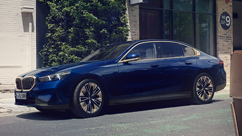 BMW 5 Series Sedan (G30) three-quarter side view driving  BMW 5 Series Sedan (G30) three-quarter side view driving