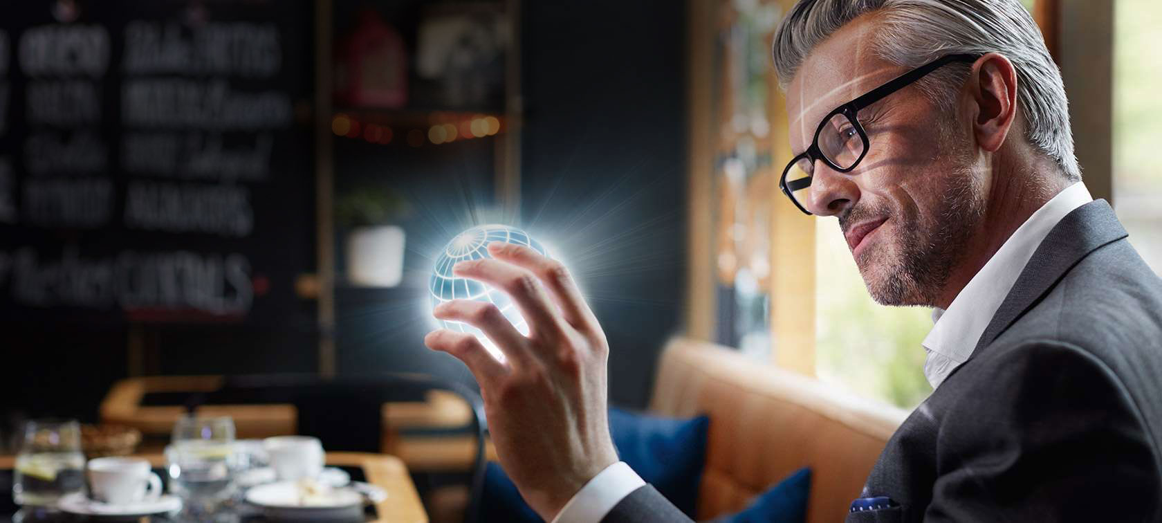 BMW 7 Series Sedan, BMW ConnectedDrive BMW ConnectedDrive: man holds lit-up globe in his hands