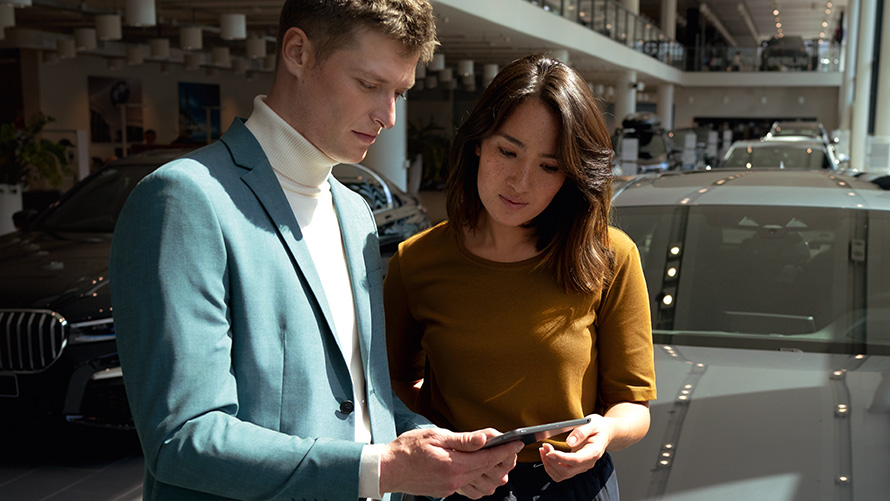 BMW employee advises a customer BMW employee advises a customer